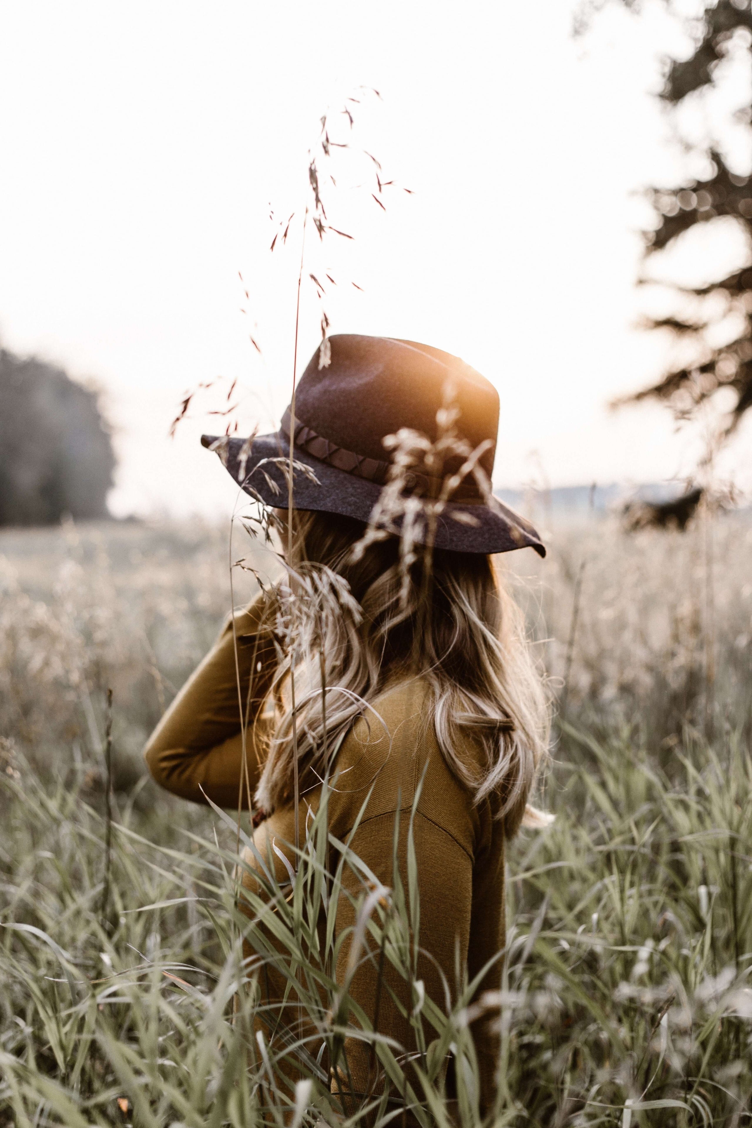 Woman on a field with wild flowers and herbs